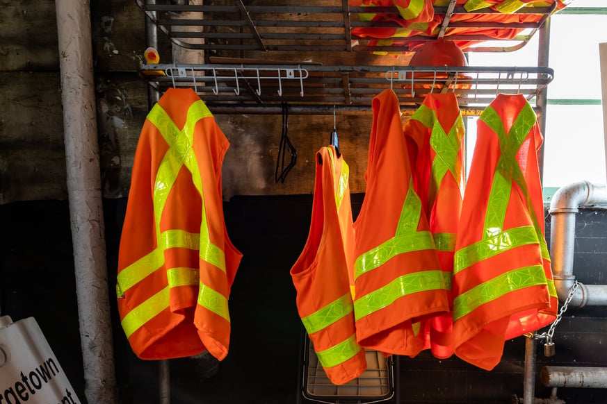 Safety Vests Hanging on Rack